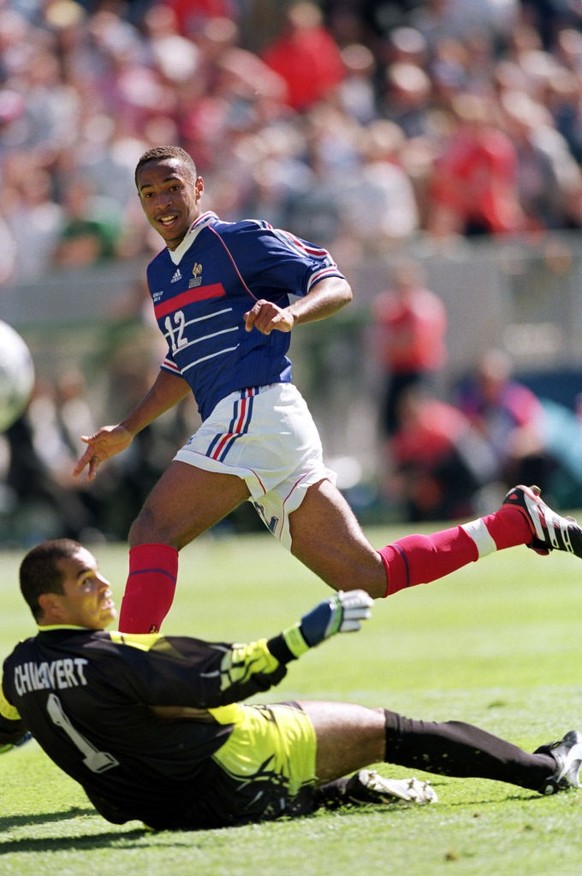 France's Thierry Henry (right) shoots past Paraguay goalkeeper Jose Luis Chilavert (left) (Photo by Michael Steele/EMPICS via Getty Images)
