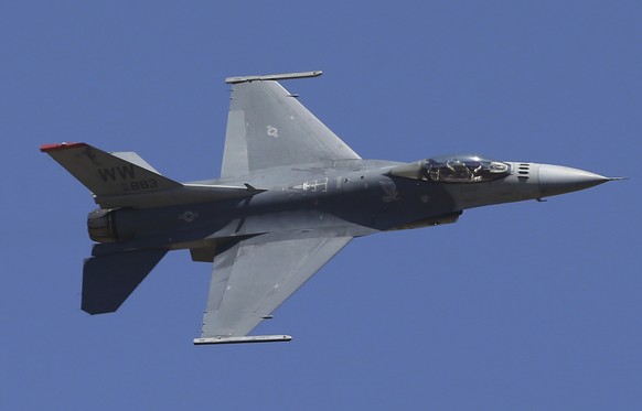 FILE - U.S. fighter aircraft F-16 performs aerobatic maneuvers on the last day of Aero India 2019 at Yelahanka air base in Bangalore, India, Feb. 24, 2019. The U.S. has once again buckled under pressu ...