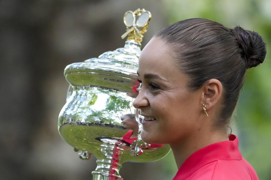 FILE - Ash Barty of Australia poses with the Daphne Akhurst Memorial Cup at a park, the morning after defeating Danielle Collins of the U.S. in the women&#039;s singles final at the Australian Open te ...