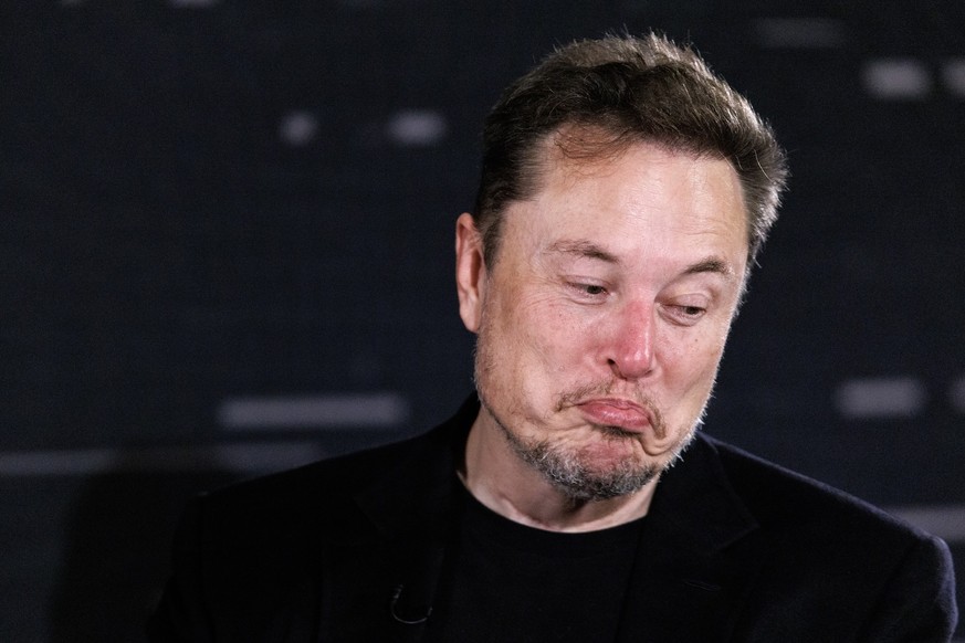 epa10998583 US tech entrepreneur Elon Musk, owner of Tesla, SpaceX and X, reacts as he attends a conversation event with British Prime Minister Rishi Sunak (unseen) in central London, Britain, 02 Nove ...