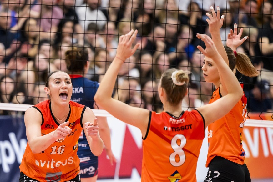 Neuchatel&#039;s players Tiata Scambray and Meline Pierret celebrate a point during the women&#039;s semi-final second leg of the women&#039;s CEV Volleyball Cup between Switzerland&#039;s Viteos Neuc ...