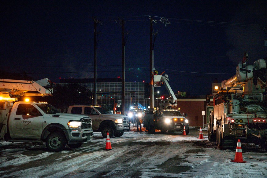 FILE - An Oncor Electric Delivery lineman crew works on repairing a utility pole that was damaged by a winter storm on Feb. 18, 2021, in Odessa, Texas. (Eli Hartman/Odessa American via AP, File)
Winte ...