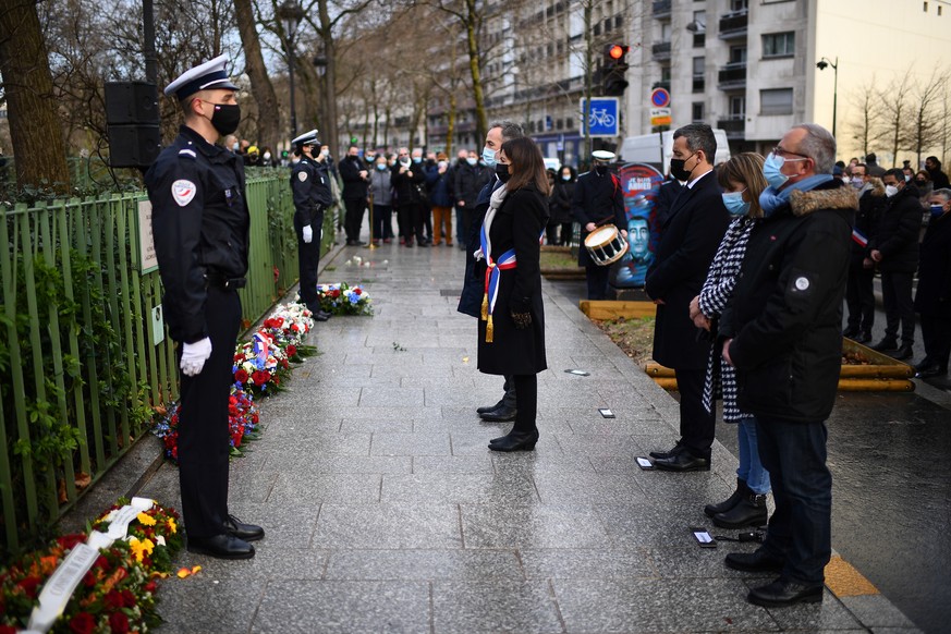 epa09671861 Paris&#039; Mayor Anne Hidalgo and First Deputy Mayor Emmanuel Gregoire pay their respects during a ceremony for French police officer Ahmed Merabet on the same day of the attack of the sa ...