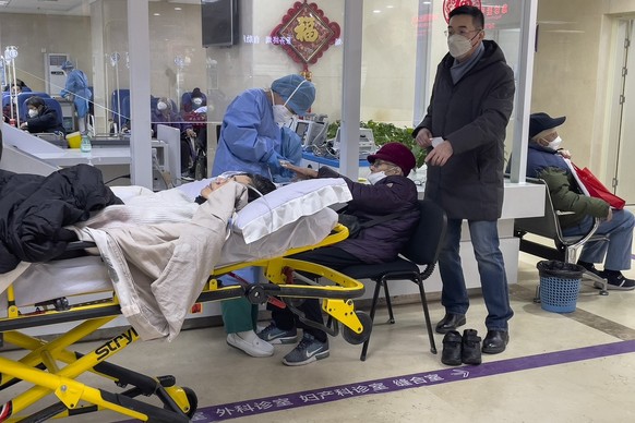 Elderly patients are checked as they arrive at an emergency hall of a hospital in Beijing, Thursday, Jan. 19, 2023. China on Thursday accused &quot;some Western media&quot; of bias, smears and politic ...