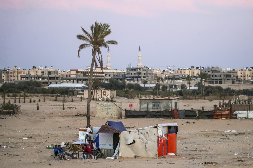 epaselect epa11383108 Palestinians reside near the border fence between the Gaza Strip and Egypt in Rafah, southern Gaza, 31 May 2024. The makeshift camp for internally displaced Palestinians previous ...
