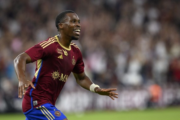 Servette&#039;s forward Dereck Kutesa celebrates his first goal during the UEFA Champions League Third qualifying round second leg soccer match between Switzerland&#039;s Servette FC and Scotland&#039 ...