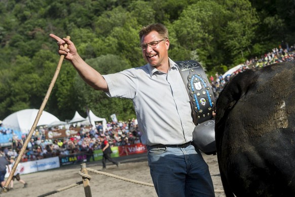 Politician Toni Brunner for SVP party reacts during the annual &quot;Finale nationale de la race d&#039;Herens&quot; or &quot;Herens national cow fighting final&quot; in Aproz, Switzerland, Sunday, Ma ...