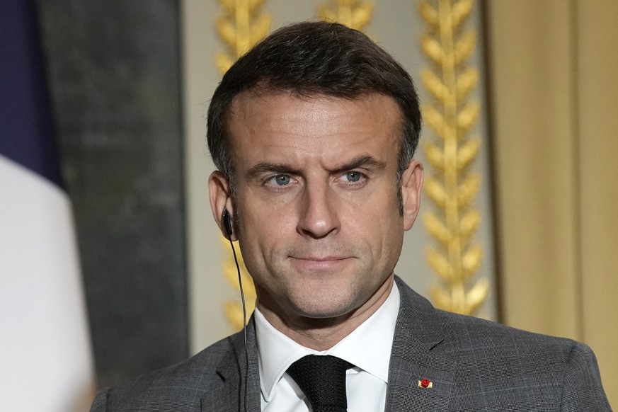 epa11038535 French President Emmanuel Macron looks on during a joint statement for the press with Czech Republic?s president at the Elysee Palace in Paris, France, 20 December 2023. EPA/Christophe Ena ...