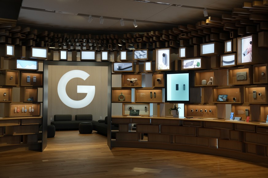 FILE - Items are displayed in the Google Store at the Google Visitor Experience in Mountain View, Calif., Oct. 11, 2023. The Justice Department says a former software engineer at Google has been charg ...