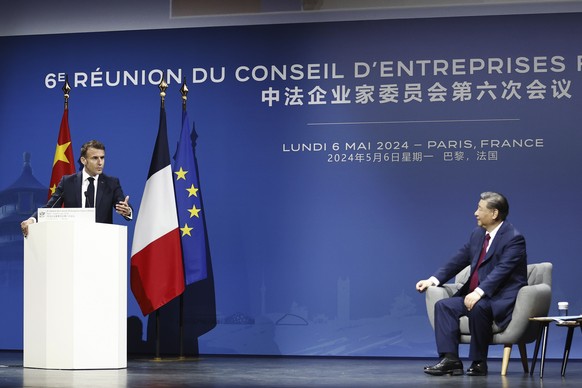 French President Emmanuel Macron speaks as Chinese President Xi Jinping listens during the 6th meeting of the Franco-Chinese Business Council at the Marigny Theater, in Paris, Monday, May 6 2024. Fren ...