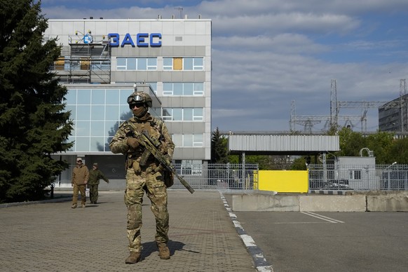 FILE - A Russian serviceman stands guard in an area of the Zaporizhzhia Nuclear Power Station in territory under Russian military control, southeastern Ukraine, on May 1, 2022. The Zaporizhzhia plant  ...