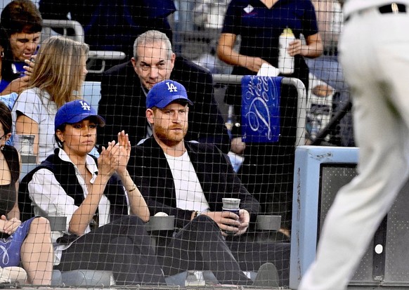 Los Angeles, CA - October 28: Prince Harry and Meghan Markle look on in the second inning of Game 4 of a World Series Baseball game between the Toronto Blue Jays and Los Angeles Dodgers at Dodger Stad ...