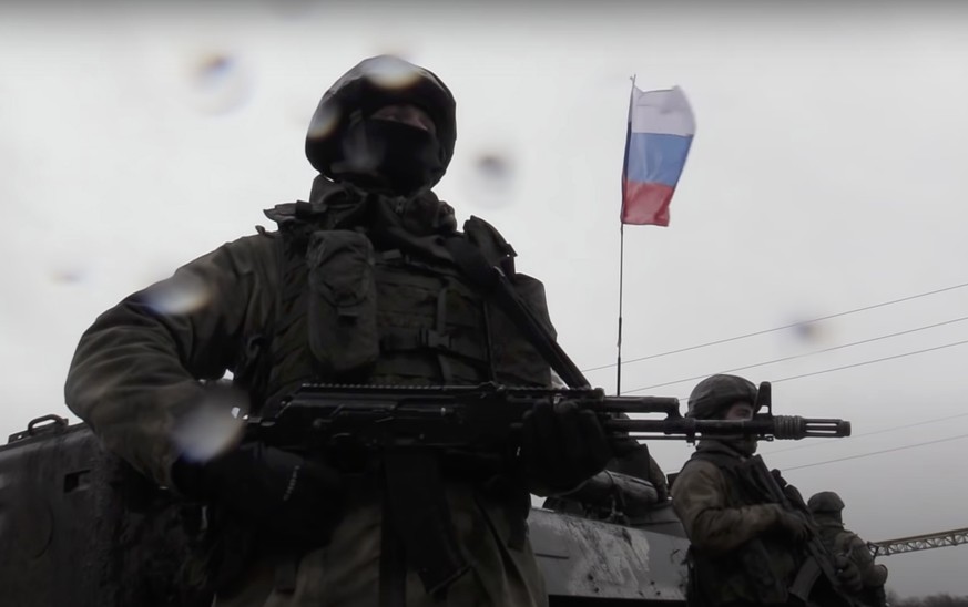 epa09800479 A still image taken from handout video made available by the Russian Defense Ministry?s press-service shows Russian servicemen guarding a checkpoint in the Luhansk region, Ukraine, 04 Marc ...