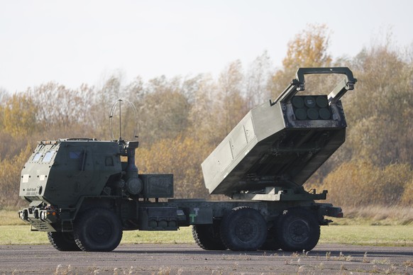 epa09545432 A view of a US High Mobility Artillery Rocket System (HIMARS) during a landing exercise at Spilva airfield in Riga, Latvia, 25 October 2021. The US Air Force special operation aircraft MC- ...