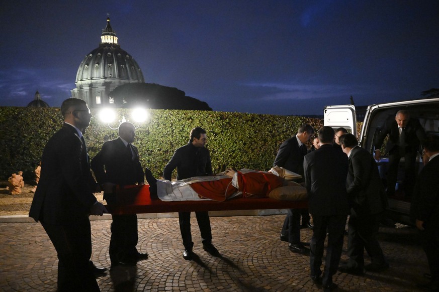 In this image released on Monday, Jan. 2, 2023, by the Vatican Media news service, the body of late Pope Emeritus Benedict XVI is carried from the chapel of the monastery &#039;Mater Ecclesiae&#039; a ...