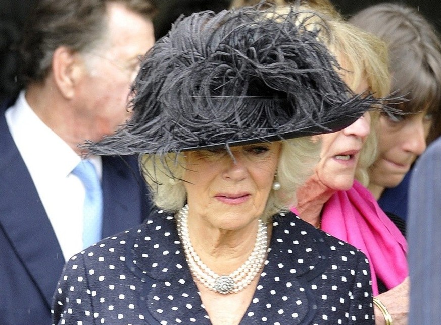 epa04187806 Camilla, Duchess of Cornwall leaves after the funeral of her brother Mark Shand held at the Holy Trinity church in Stourpaine, Dorset, Britain, 01 May 2014. The British travel writer and c ...