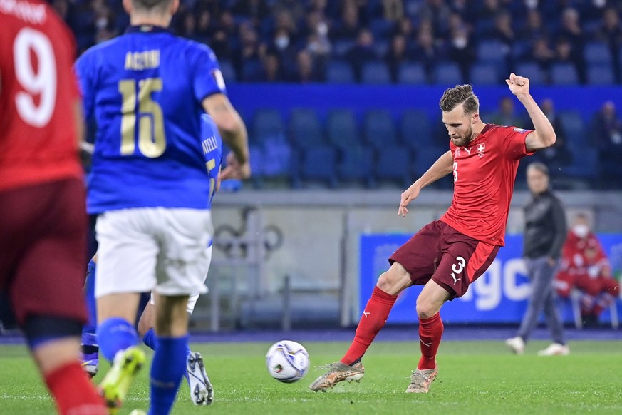 Switzerland&#039;s defender Silvan Widmer, right, scores the first goal during the 2022 FIFA World Cup European Qualifying Group C match between Italy and Switzerland at the Stadio Olimpico in Rome, I ...