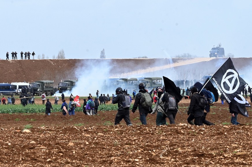 epa10543019 Protesters clash with police as people take part in a demonstration called &#039;Bassines non merci&#039; (lit.: No to reservoirs, thank you) against the construction of a new water storag ...