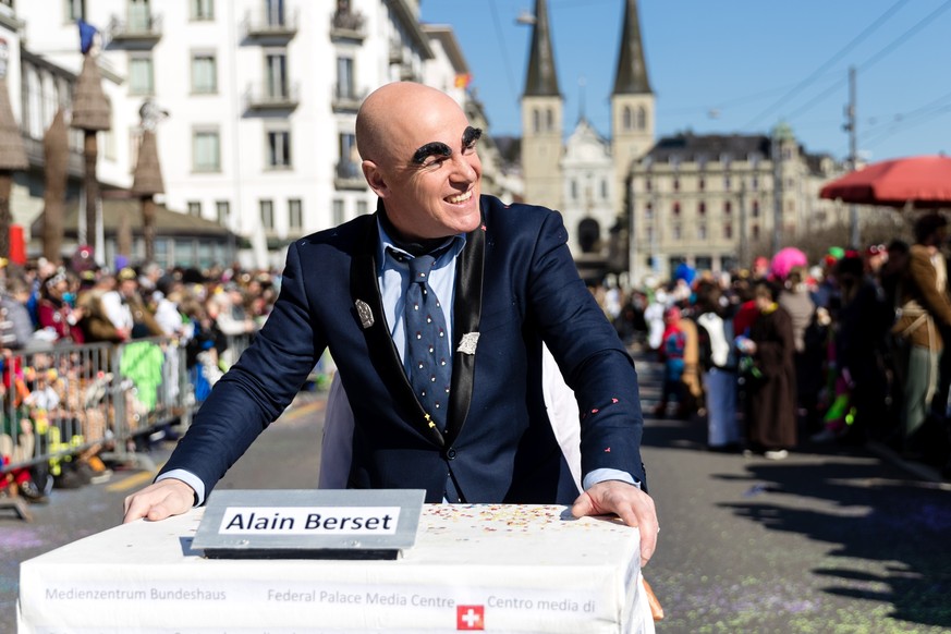 A carnival reveller dressed up as Swiss health minister Alain Berset parades through the streets during the carnival parade (Wey Umzug) on Monday, February 28, 2022 in Lucerne, Switzerland. The carniv ...