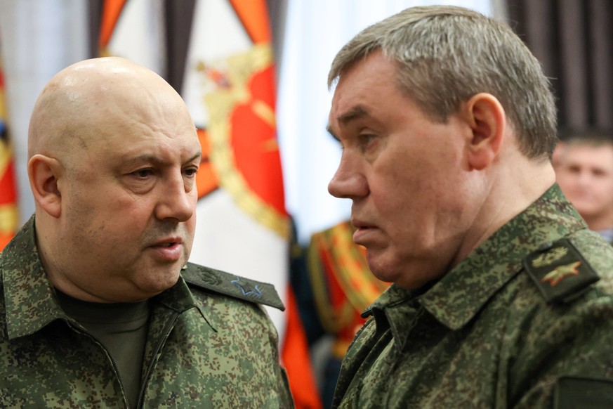 RUSSIA - DECEMBER 31, 2022: Army Gen Sergei Surovikin L, commander of the joint group of forces in the special military operation area, and Valery Gerasimov, Chief of the General Staff of the Russian  ...
