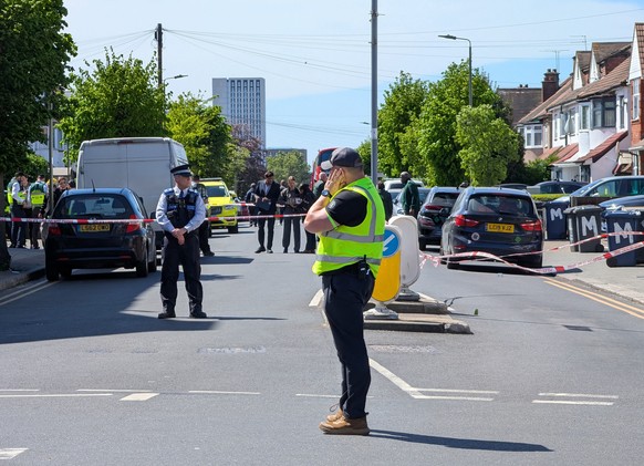 Police officers at the scene in Golders Green after two people were stabbed, in north-west London, Wednesday April 29, 2026. (Jamie Lashmar/PA via AP)
Britain Stabbing