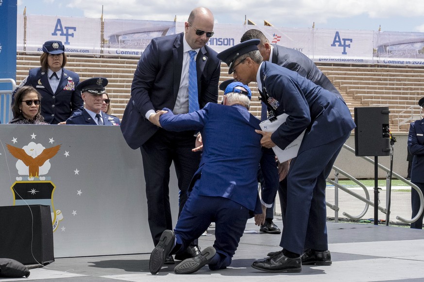 President Joe Biden falls on stage during the 2023 United States Air Force Academy Graduation Ceremony at Falcon Stadium, Thursday, June 1, 2023, at the United States Air Force Academy in Colorado Spr ...