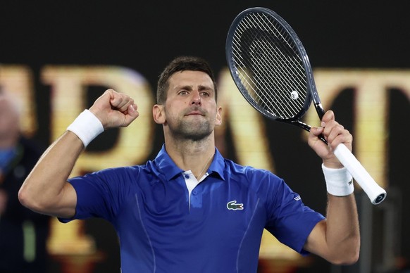 Novak Djokovic of Serbia celebrates after defeating Tomas Martin Etcheverry of Argentina in their third round match at the Australian Open tennis championships at Melbourne Park, Melbourne, Australia, ...