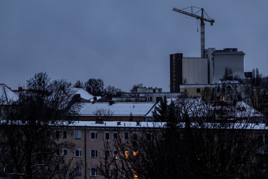 epa12623547 Residential houses are seen in front of the Lichterfelde combined heat and power plant, responsible for supplying electricity and district heat to Berlins southwest, Berlin, Germany, 03 J ...