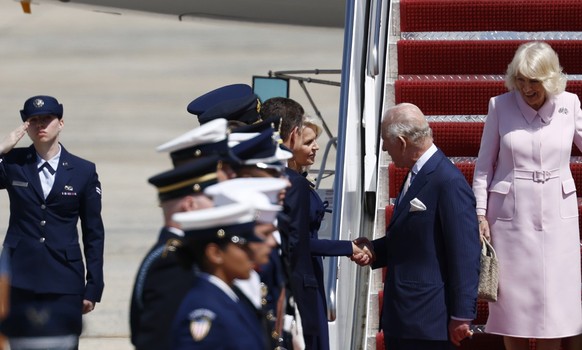 epa12917916 Britain's King Charles III (L) and Queen Camilla (R) arrive at Joint Base Andrews, Maryland, USA, 27 April 2026. King Charles III and Queen Camilla are visiting the US on a four-day s ...