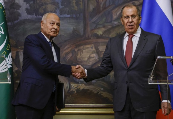 epa10909256 Russian Foreign Minister Sergey Lavrov (R) shakes hands with Arab League Secretary-General Ahmed Aboul Gheit during their meeting in Moscow, Russia, 09 October 2023. EPA/SERGEI ILNITSKY