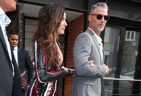 LONDON, ENGLAND - JUNE 13: Sandra Bullock and Bryan Randall leaving their hotel ahead of the 'Ocean's 8' film premiere on June 13, 2018 in London, England. (Photo by Neil Mockford/GC Im ...