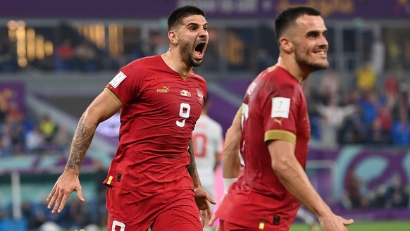 epa10345035 Aleksandar Mitrovic of Serbia (L) celebrates scoring the 1-1 during the FIFA World Cup 2022 group G soccer match between Serbia and Switzerland at Stadium 947 in Doha, Qatar, 02 December 2 ...