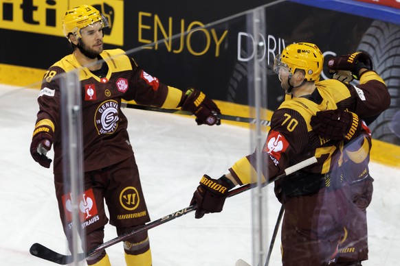 Geneve-Servette&#039;s forward Teemu Hartikainen celebrates his goal with his teammate Geneve-Servette&#039;s forward Marc-Antoine Pouliot, left, after scoring the 1:1, during the Champions Hockey Lea ...