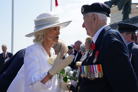 VER-SUR-MER, FRANCE - JUNE 6: Queen Camilla speaks to D-Day veteran Henry Rice, 98, from Surrey, following the UK national commemorative event for the 80th anniversary of D-Day, held at the British No ...