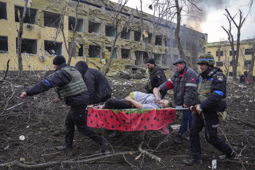 A pregnant woman whose pelvis had been crushed and her hip detached during Russian shelling is evacuated from a maternity in Mariupol, Ukraine, March 9, 2022. The woman was taken to another hospital c ...