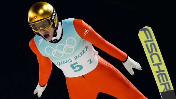 Gregor Deschwanden, of Switzerland, soars through the air during a men&#039;s team ski jumping trial round for competition at the 2022 Winter Olympics, Monday, Feb. 14, 2022, in Zhangjiakou, China. (A ...