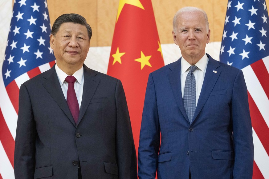 U.S. President Joe Biden, right, stands with Chinese President Xi Jinping before a meeting on the sidelines of the G20 summit meeting, Monday, Nov. 14, 2022, in Bali, Indonesia. President Biden and ot ...