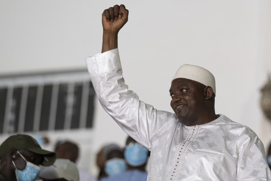 Gambian President Adama Barrow celebrates after winning the presidential election in Banjul, Gambia, Sunday, Dec. 5, 2021. Barrow has secured his re-election with a comfortable margin over his opposit ...