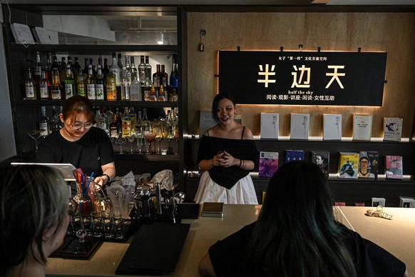 The photo taken on July 18, 2025 shows women chatting in the all-female cultural space &quot;Half the Sky&quot; in Beijing. Laughter erupts over a board game and coffees at a rural cottage in China&#0 ...