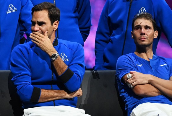 epa10202789 Team Europe player Roger Federer (L) of Switzerland sitting next to doubles partner Rafael Nadal of Spain after losing their match against Team World double Jack Sock of the US and Frances ...