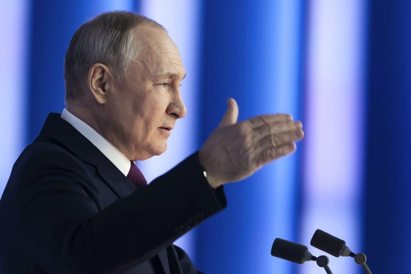 Russian President Vladimir Putin gestures as he gives his annual state of the nation address in Moscow, Russia, Tuesday, Feb. 21, 2023. (Mikhail Metzel, Sputnik, Kremlin Pool Photo via AP)