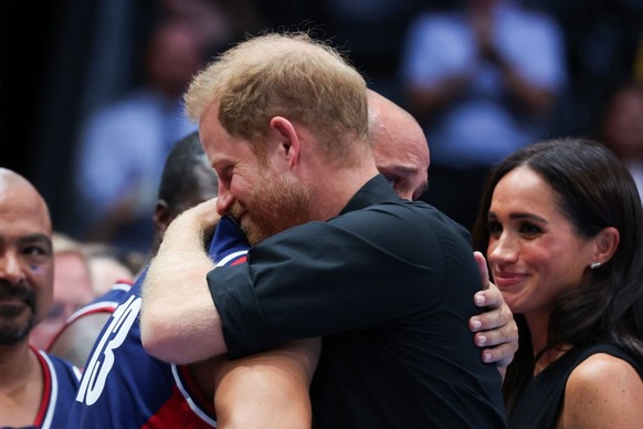 DUESSELDORF, GERMANY - SEPTEMBER 13: Prince Harry, Duke of Sussex attends the medal ceremony and congratulates the winning team from the USA at Wheelchair Basketball Finals between USA and France at C ...