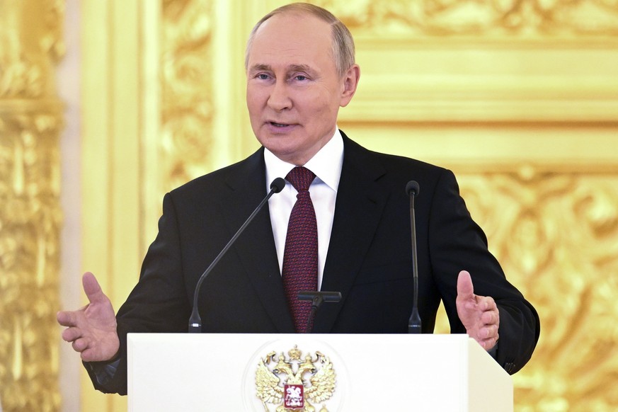 Russian President Vladimir Putin gestures while delivering his speech at a ceremony to receive credentials from newly appointed foreign ambassadors to Russia in the Kremlin, in Moscow, Russia, Tuesday ...