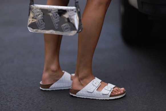 BERLIN, GERMANY - AUGUST 06: Anna Winter wearing Birkenstock white sandals, by Far silver shiny logo bag on August 06, 2022 in Berlin, Germany. (Photo by Jeremy Moeller/Getty Images)