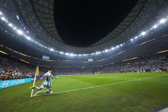 Argentina&#039;s Lionel Messi takes a corner kick during the World Cup final soccer match between Argentina and France at the Lusail Stadium in Lusail, Qatar, Sunday, Dec. 18, 2022. (AP Photo/Petr Dav ...