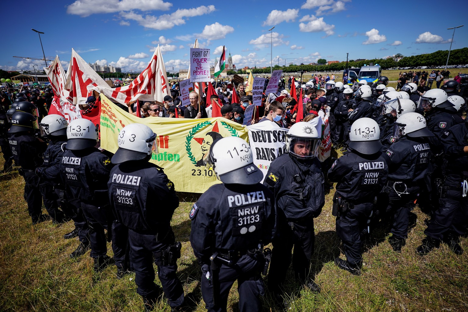 epaselect epa10033415 Police officers face activists during a demonstration related to the G7 Summit in Munich, Germany, 25 June 2022. Germany is hosting the G7 summit at Elmau Castle near Garmisch-Pa ...