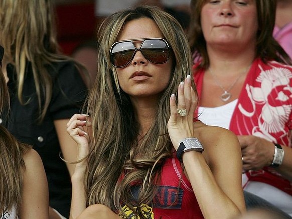 NUREMBERG, GERMANY - JUNE 15: (L to R) Singer Cheryl Tweedy the girlfriend of Ashley Cole and Victoria Beckham the wife of England Captain David Beckham, attend the FIFA World Cup Germany 2006 Group B ...