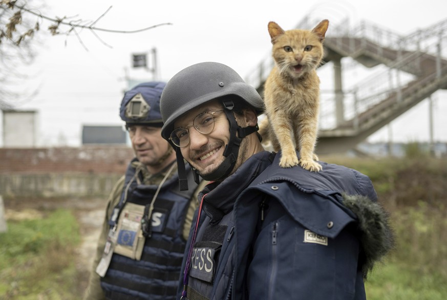 Agence France-Presse journalist Arman Soldin smiles to photographer as a cat stands on his shoulders in Ukraine, Friday, Nov. 11, 2022. Colleagues of Arman Soldin, the AFP journalist slain in Ukraine  ...