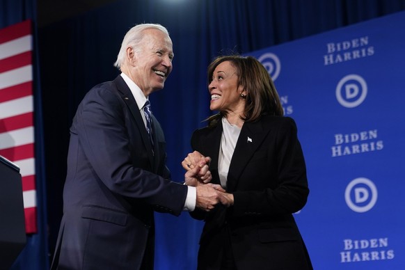 President Joe Biden speaks with Vice President Kamala Harris after speaking at the Democratic National Committee Winter Meeting, Friday, Feb. 3, 2023, in Philadelphia. (AP Photo/Patrick Semansky)