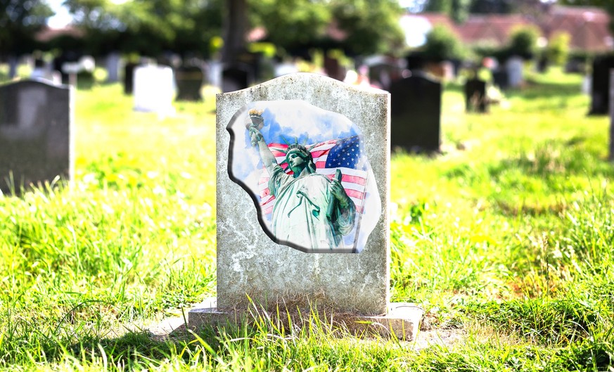 Blank gravestone with other graves and trees in background. Old stone.